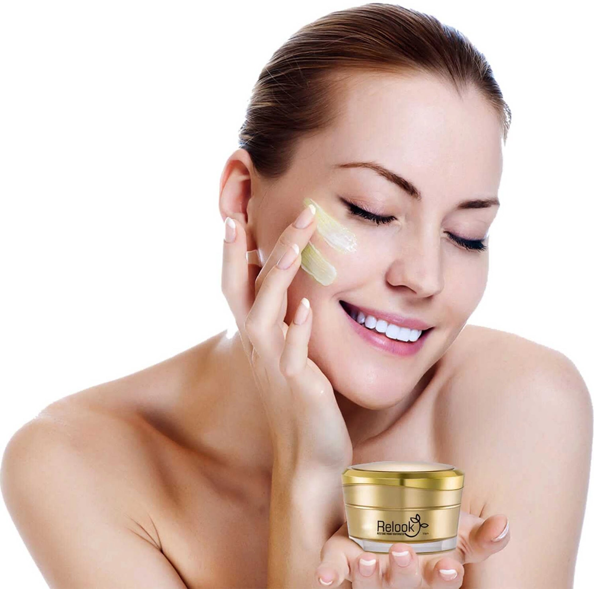 Woman applying cream to her face with a jar of cream in her hand on a white background