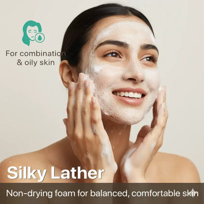 Woman applying Silky Lather to her face with a beige background